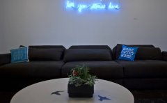 A small conference room illuminated by a neon sign with the saying "tell your story here" at Twitters new global headquarters in San Francisco, California, USA 20 Sep 2012. (Peter DaSilva for The New York Times) NYTCREDIT: Peter DaSilva for The New York T